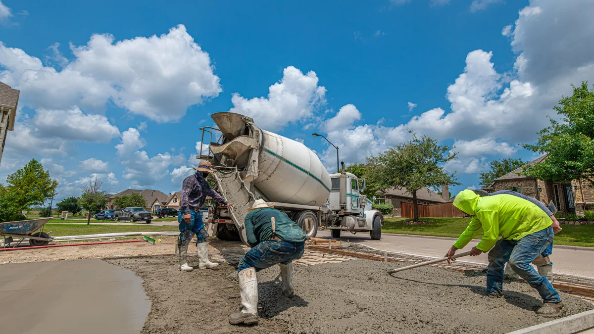 Freshly poured and troweled concrete slab with finishing tools, representative of residential flatwork in the Reno/Sparks area